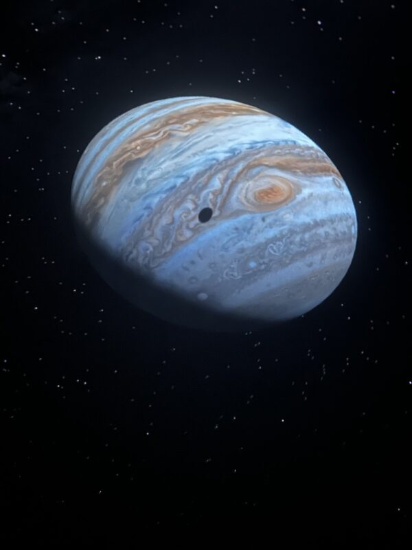 Jupiter, with a moon shadow, generated with Starry Night software on a planetarium dome.